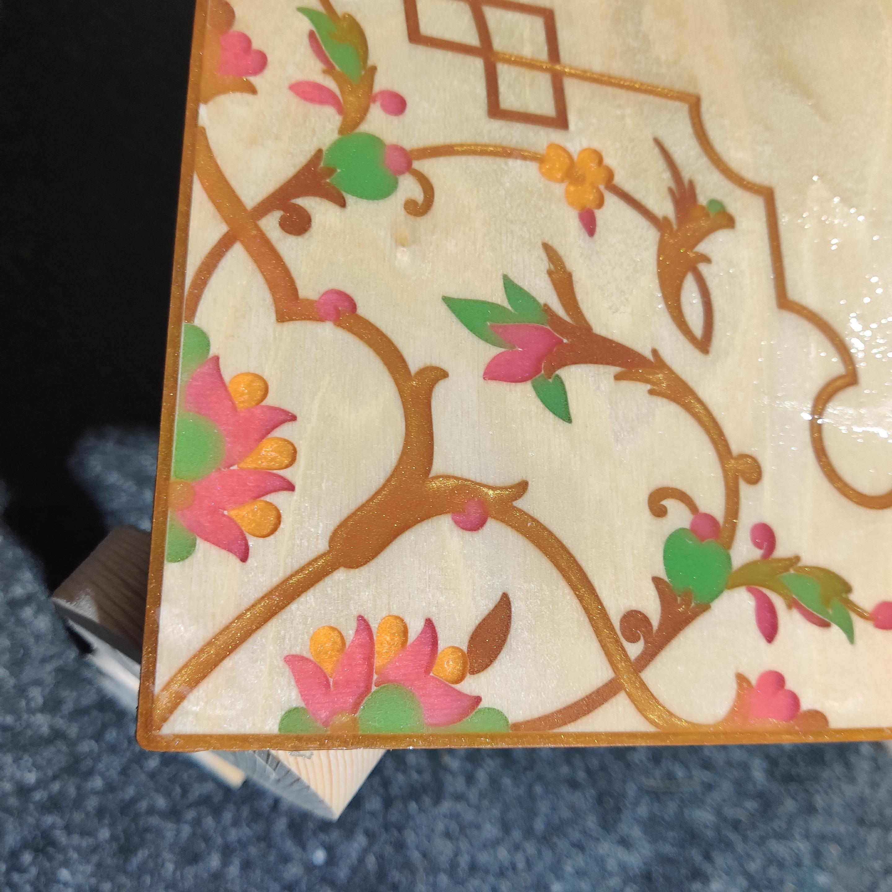 Edge of ply coffee table, with CNC routed design filled with coloured resin.