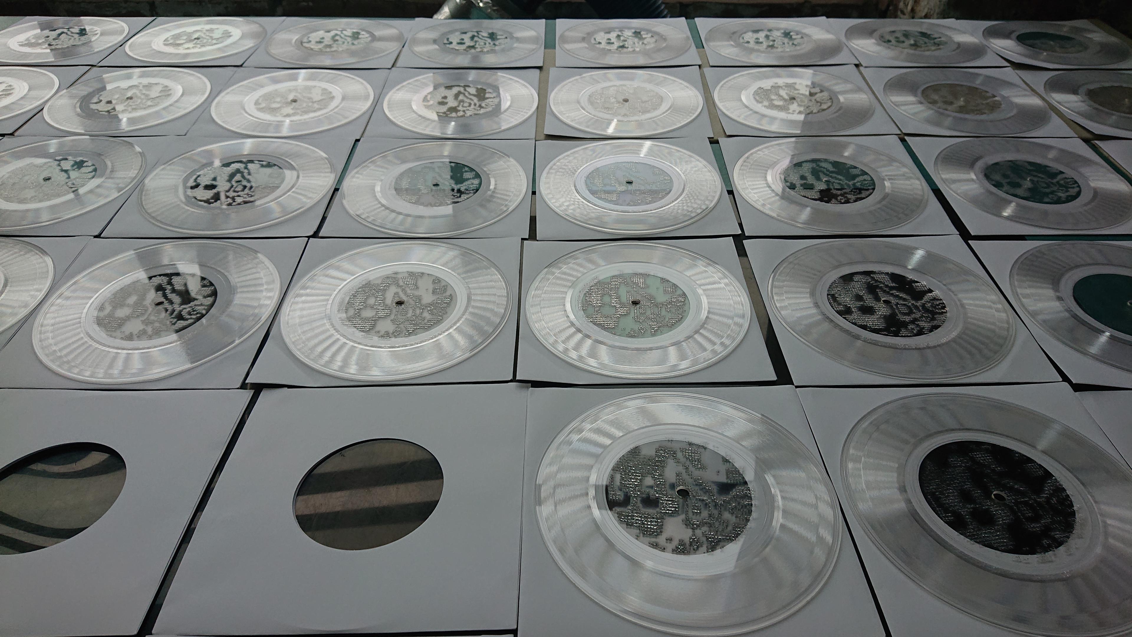 Further on in the production run, records now covering the laser-cutter lid entirely