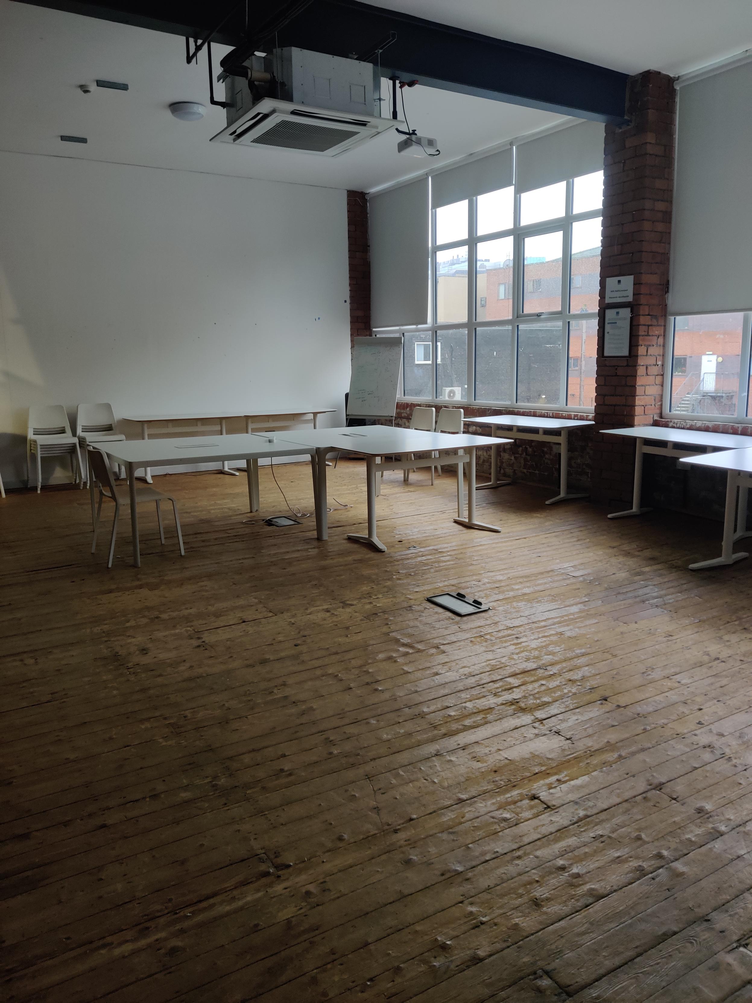 Our event space with a few tables set out for a meeting 