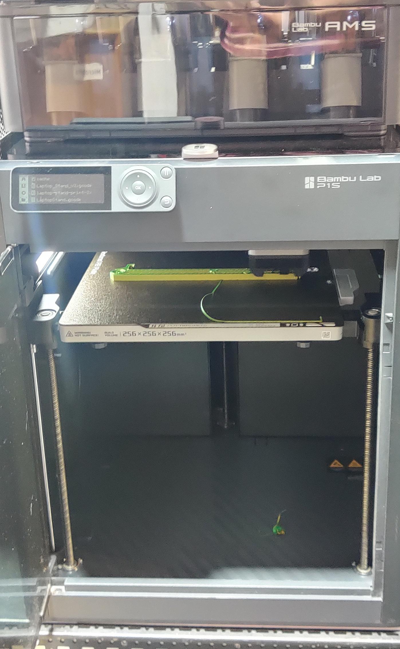 A P1S 3D printer on a rack