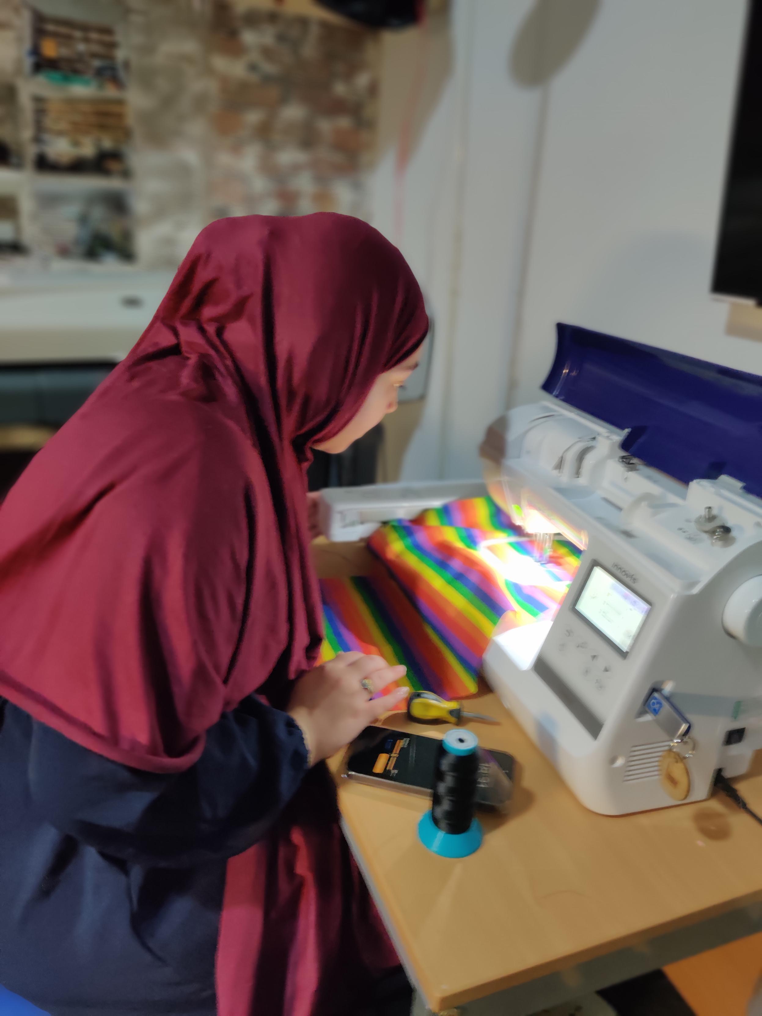 Natalie using the embroidery machine 