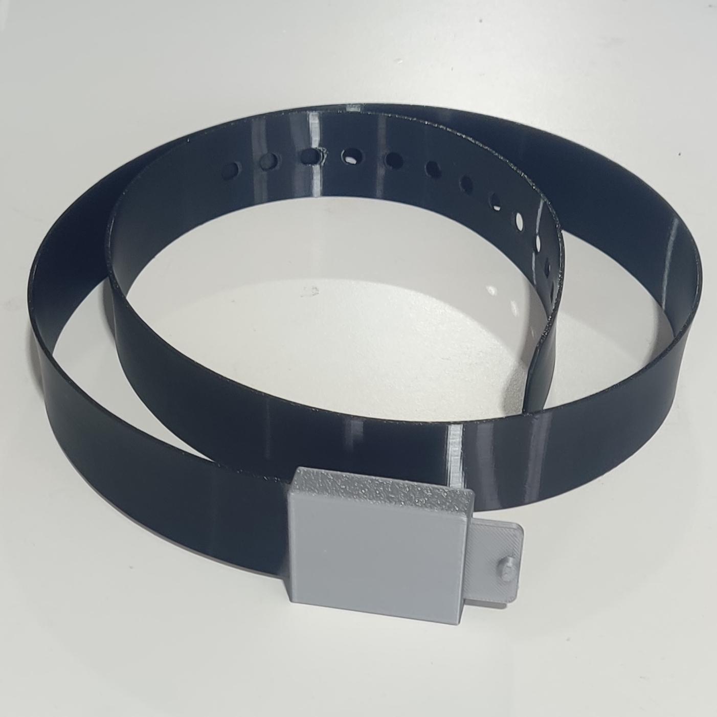A belt made with flexible black TPU, with a grey buckle
