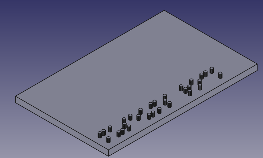 Screengrab of an isometric view of a grey rectangle, rendered in FreeCAD. Along the bottom edge of it there's a pattern of raised dots from some braille text