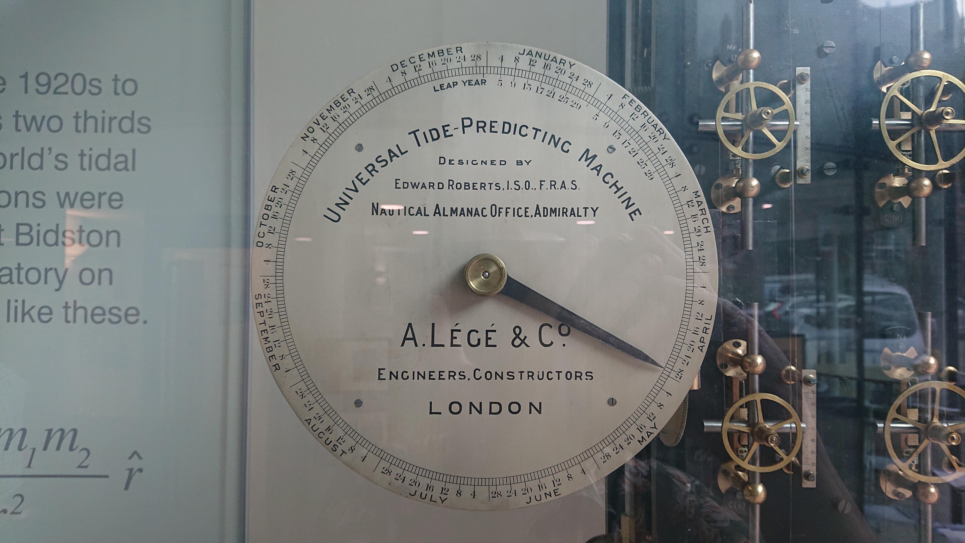 A dial showing the months and days of the year around its edge and a pointer indicating April 28th. The centre is labelled 