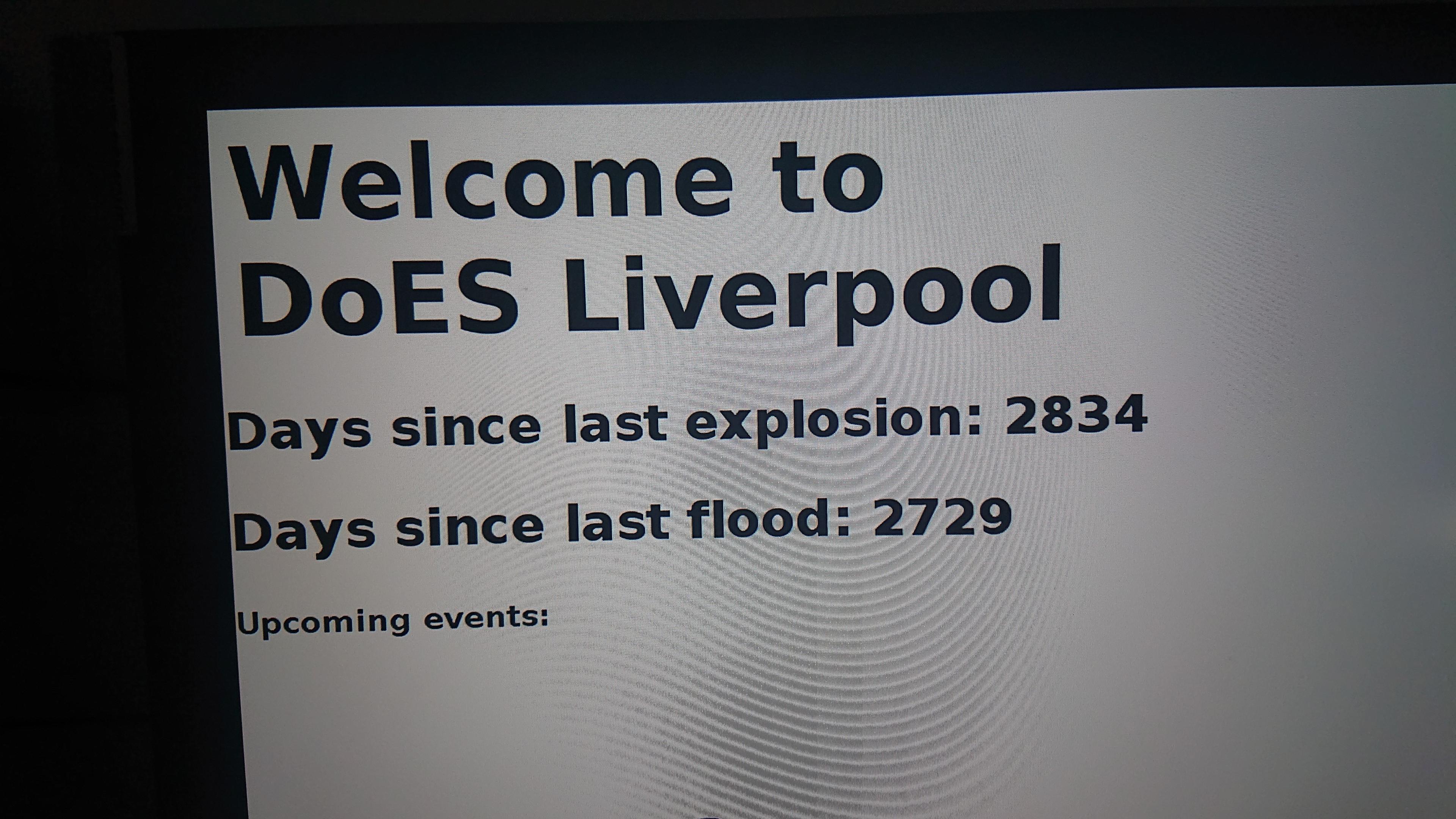 A corner of a computer monitor that's displaying: Welcome to DoES Liverpool Days since last explosion: 2834 Days since last flood: 2729