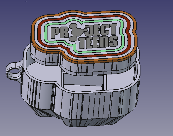 screenshot of a freecad design of a two piece stim clicker. The top face has the words 'project teens' and three coloured bands