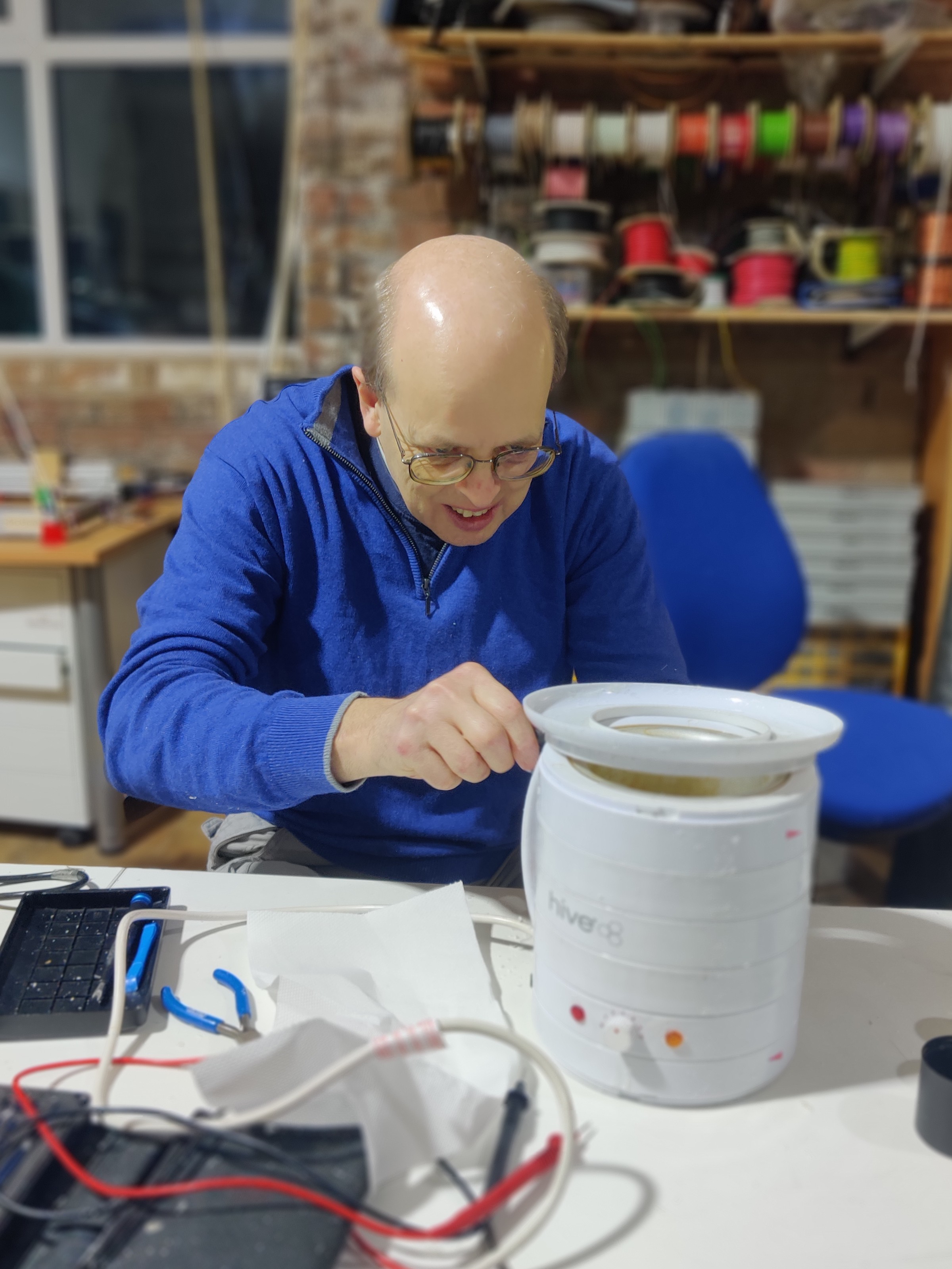 Mike reattaching part of a wax melter