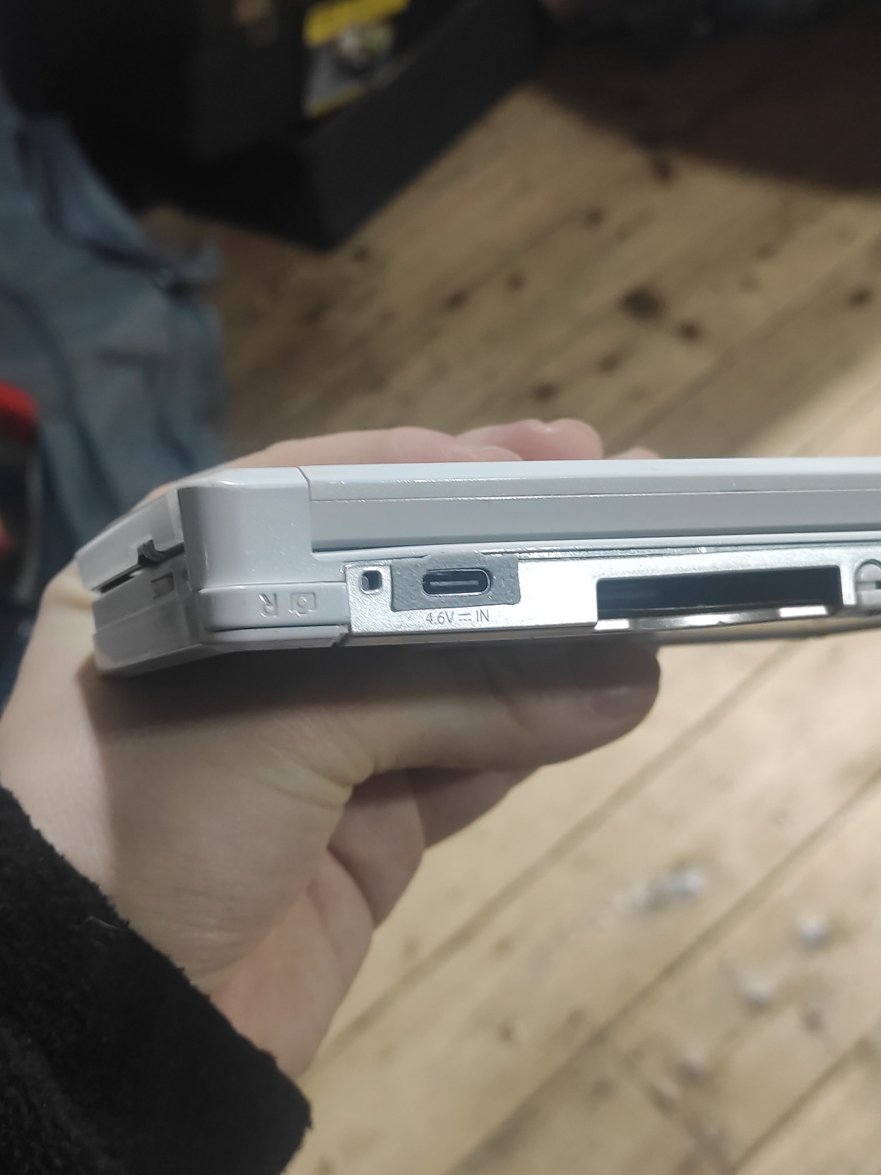 A nintendo 3DS with its charging port replaced by a USB C connector