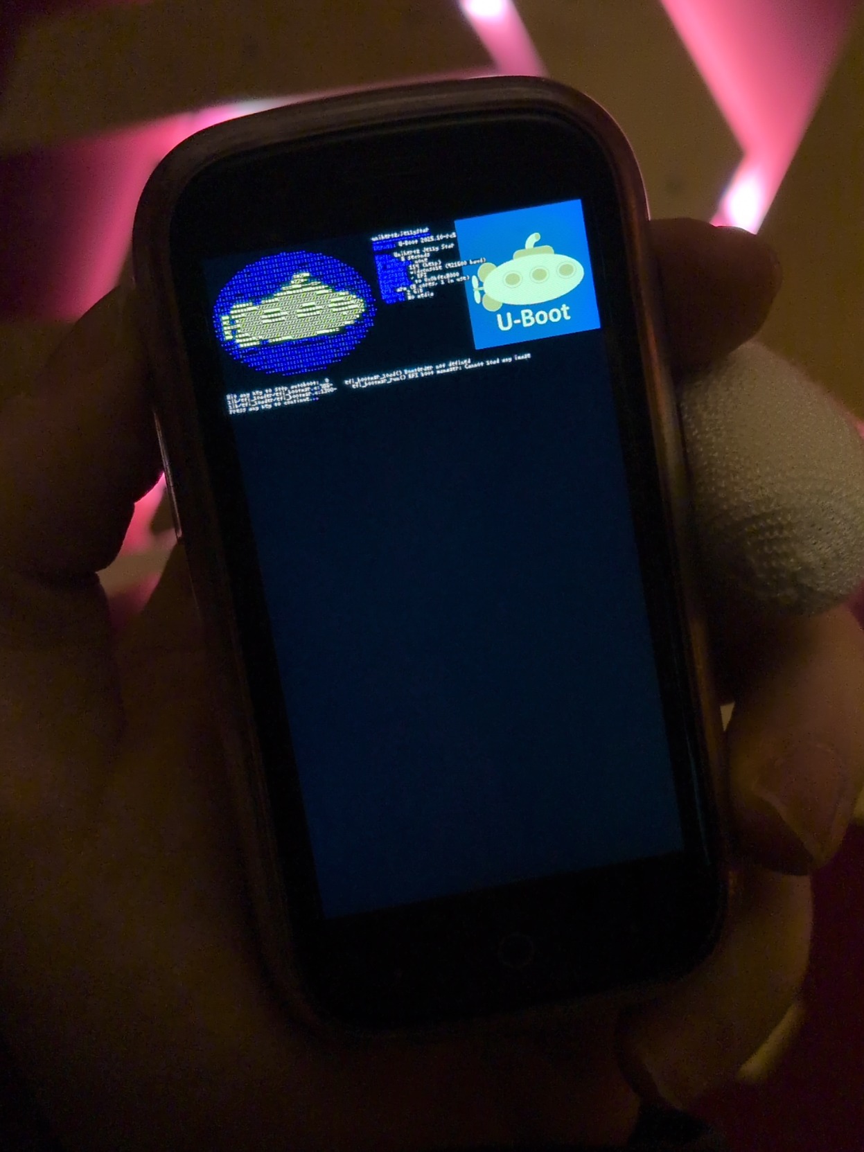 Holding the jelly star in hand with the u-boot ufetch and logo output still showing
